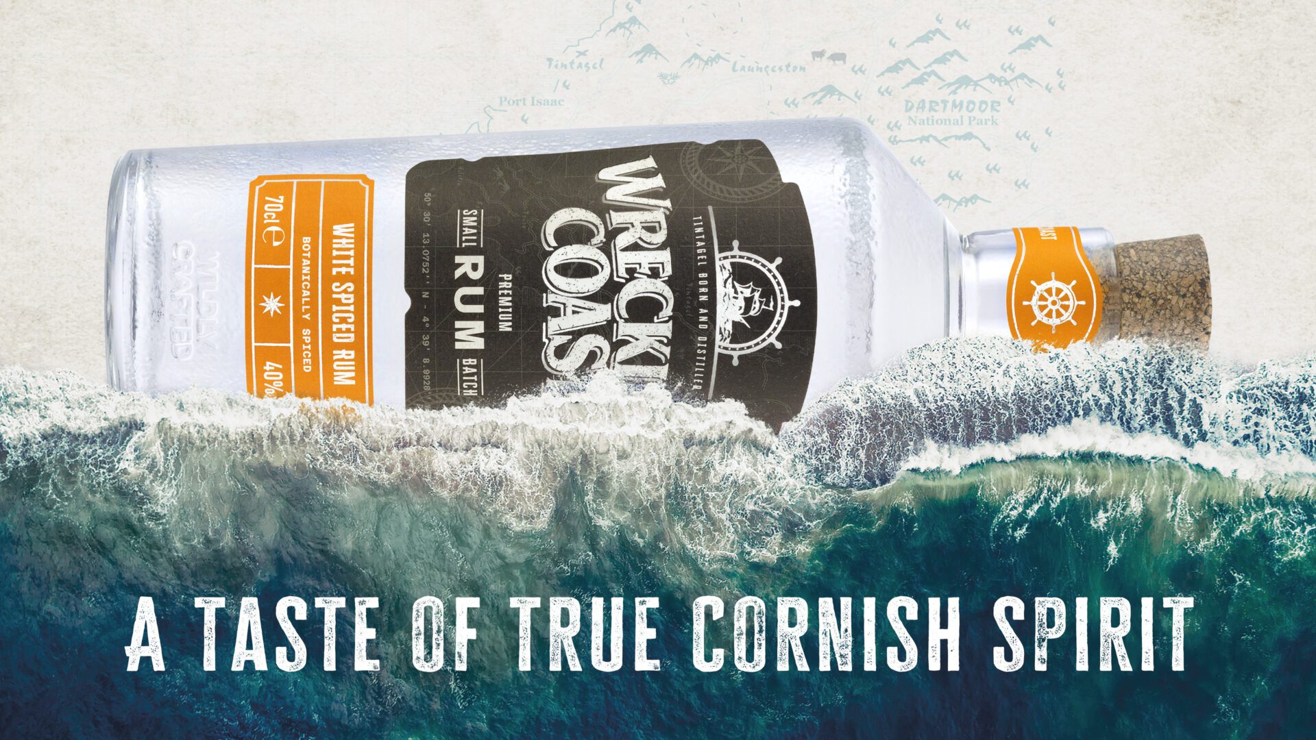 A bottle of Wrecking Coast White Spiced Rum on its side