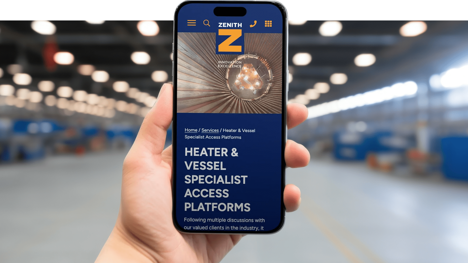 Zenith website displayed on a mobile phone with a person holding the phone