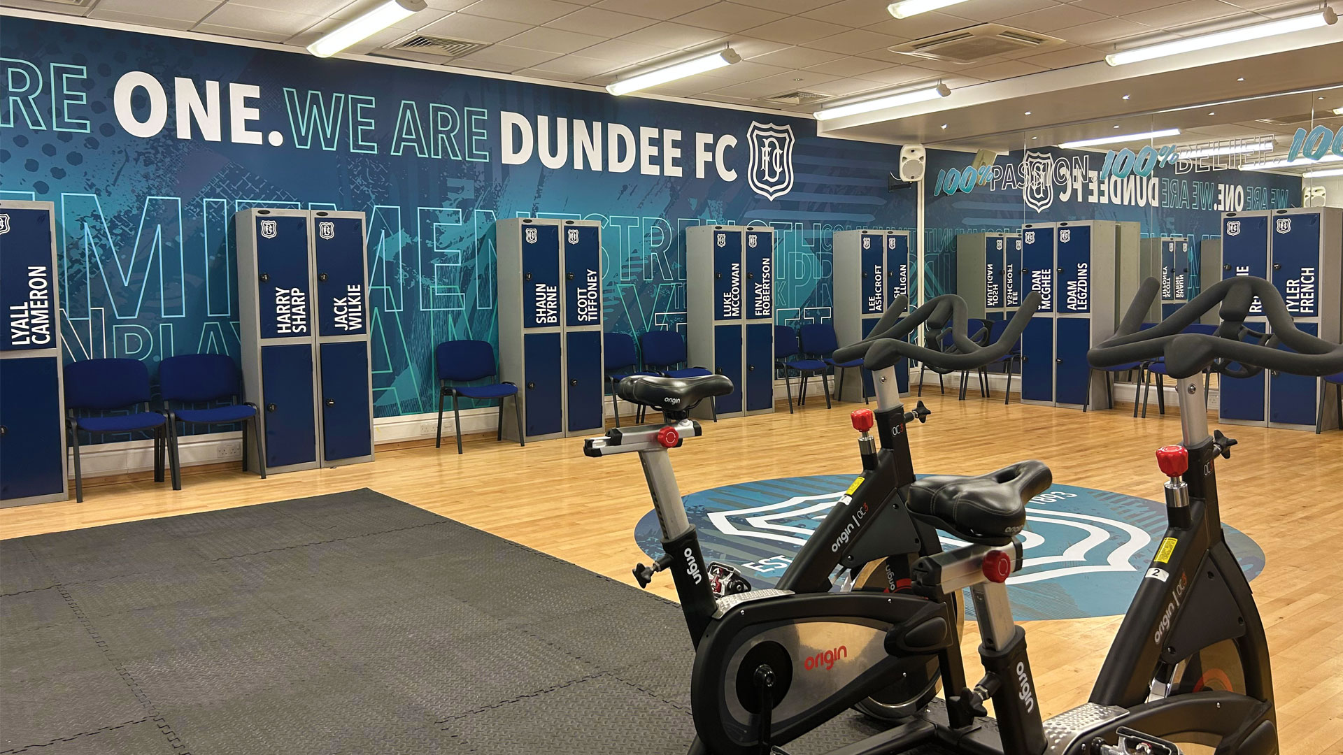 Dundee FC lockers and wall branded with Dundee FC branding in there gym