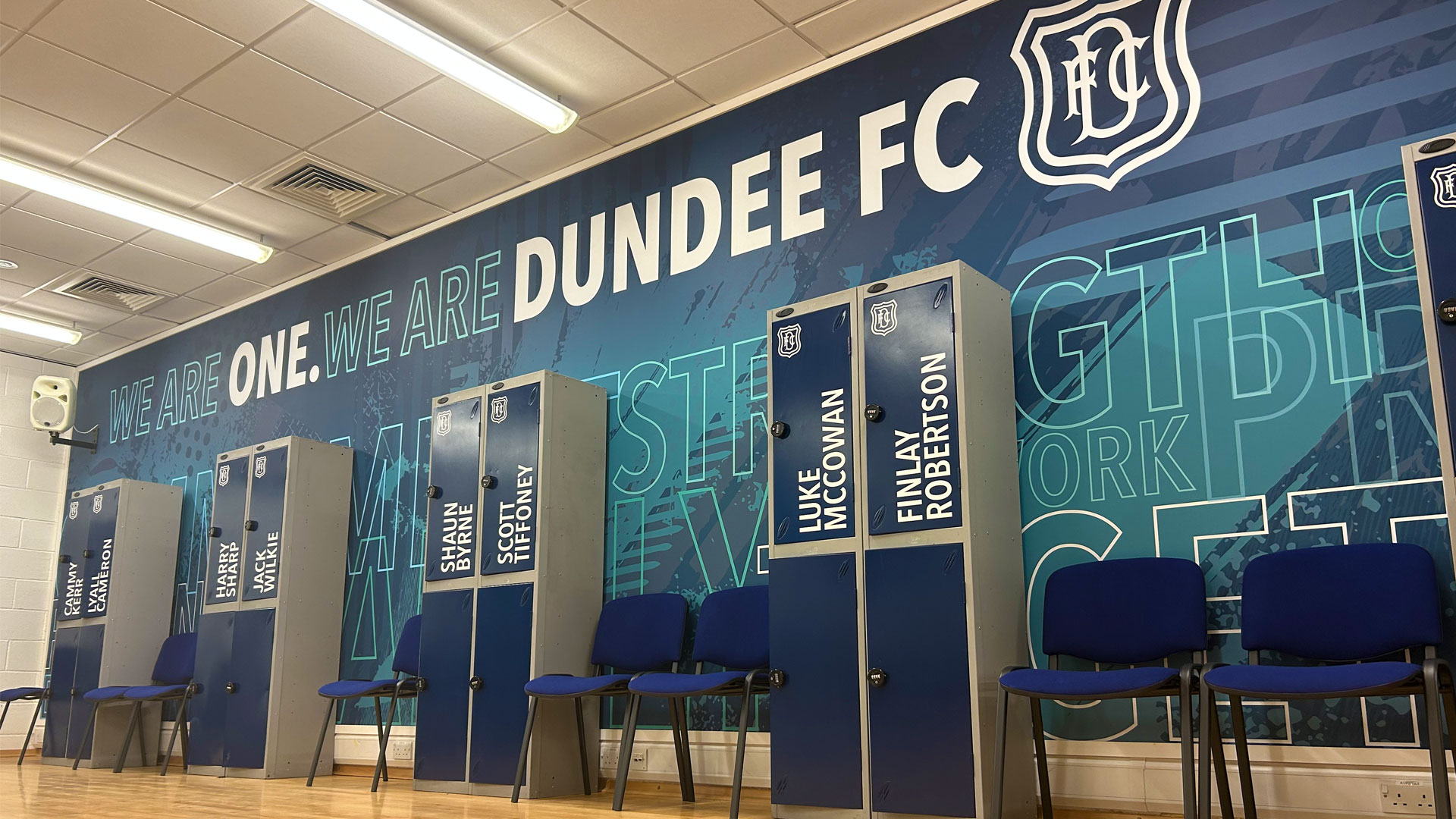 Dundee FC lockers and wall branded with Dundee FC branding