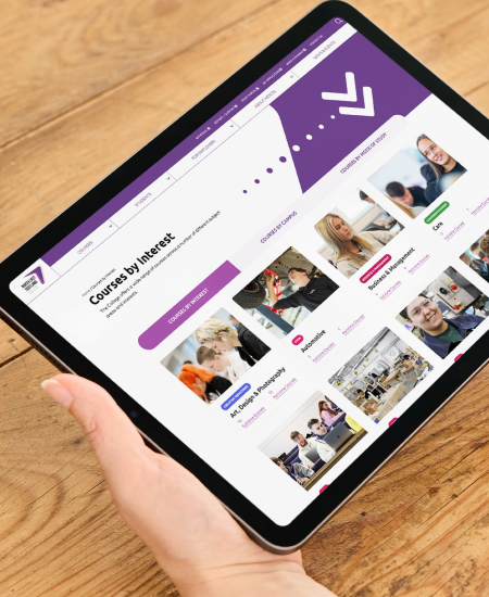 A tablet showing the NESCol Website