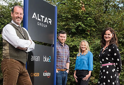 Scott, Vicki, Nial and Elaine in front of the company sign