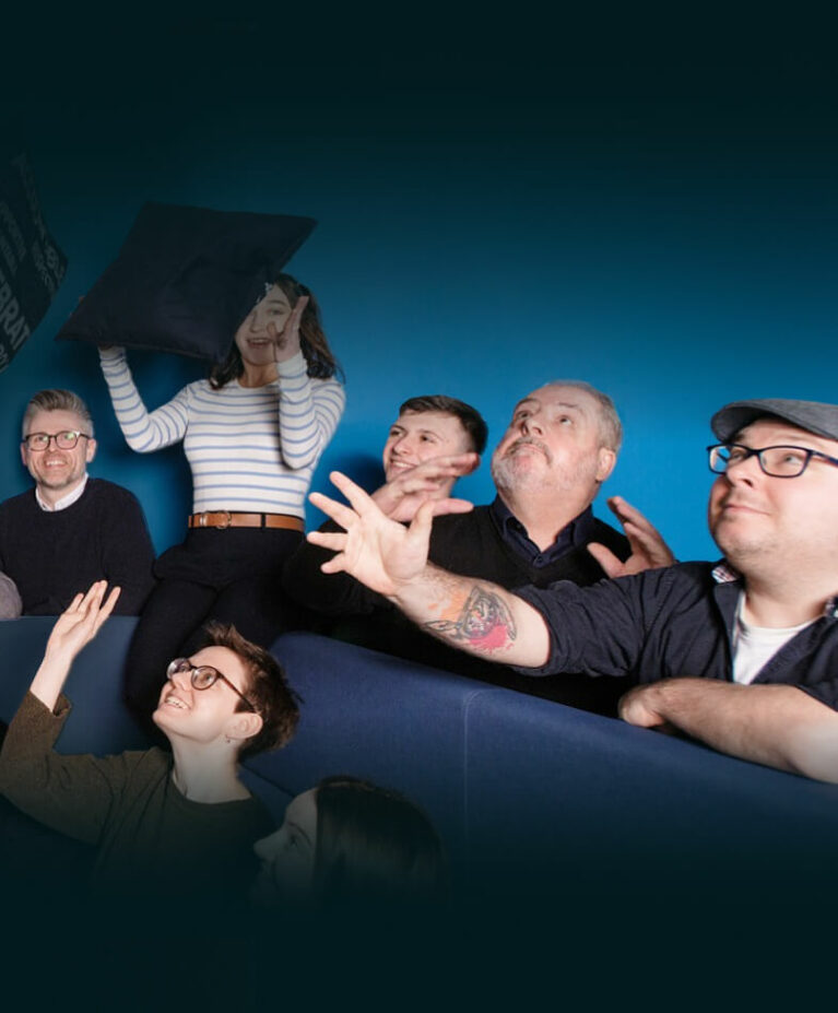 Altar staff members looking towards the flying cushions