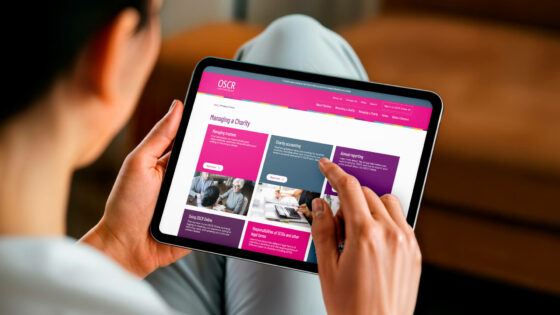 A tablet showcasing the OSCR website