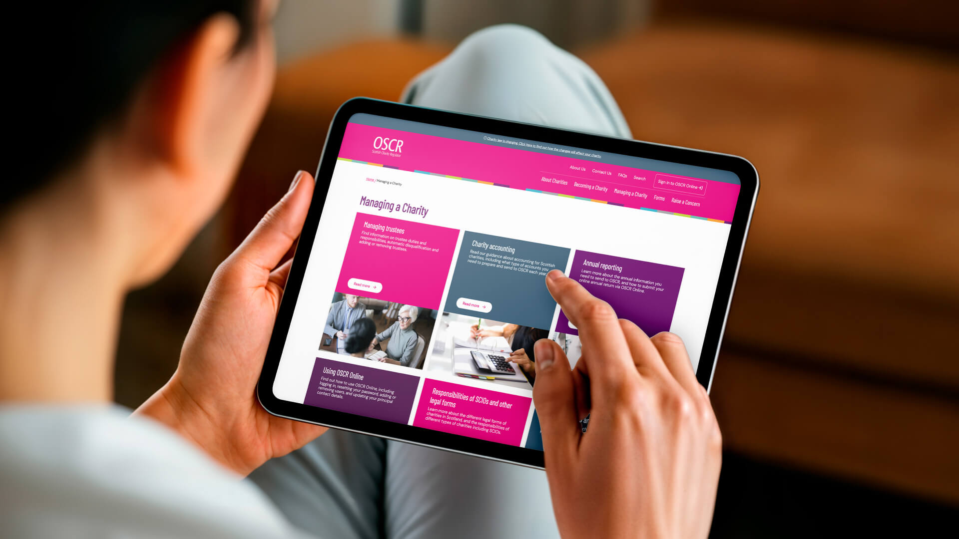 A tablet showcasing the OSCR website