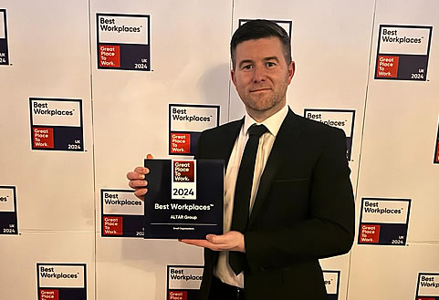 Nial holding up Best workplace award 2024