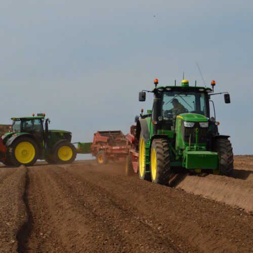Tractors in a field representing agritech