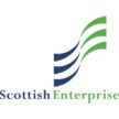 A logo featuring three upward-curving, parallel waves in navy blue and bright green, followed by the text "Scottish Enterprise."