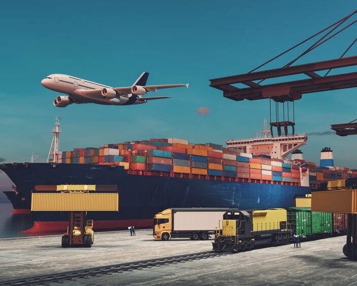 A busy global logistics hub at twilight featuring a large container ship docked at a port, a cargo plane flying overhead, a freight train, a semi-truck, and heavy machinery handling shipping containers under large orange cranes.