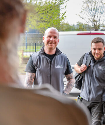two tradespeople arriving at a tenant's door