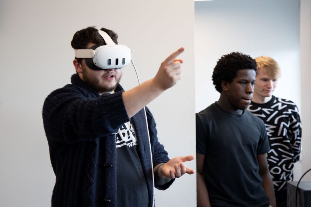 Douglas demonstrating how the VR headset works