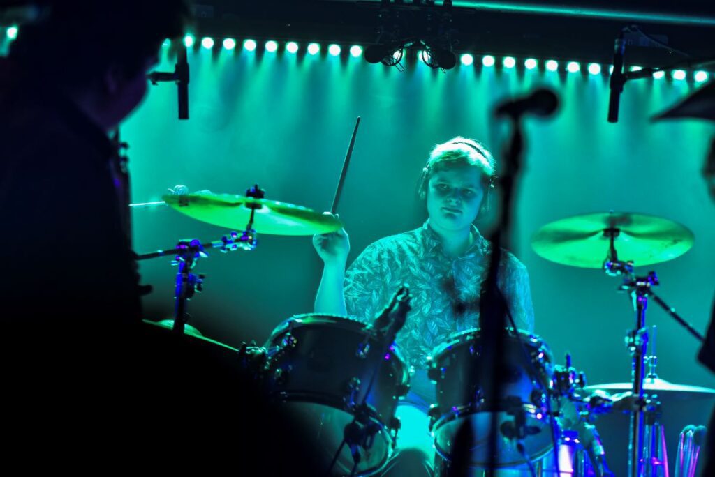 Louise playing drums on stage for International Space Station, at Krakatoa.