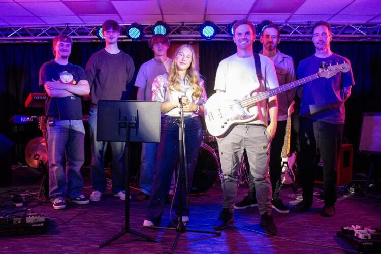 One Direction’s bassist Sandy Beales inspires NESCol music students