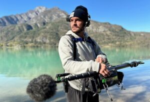 Rosco Yule with audio equipment near water.