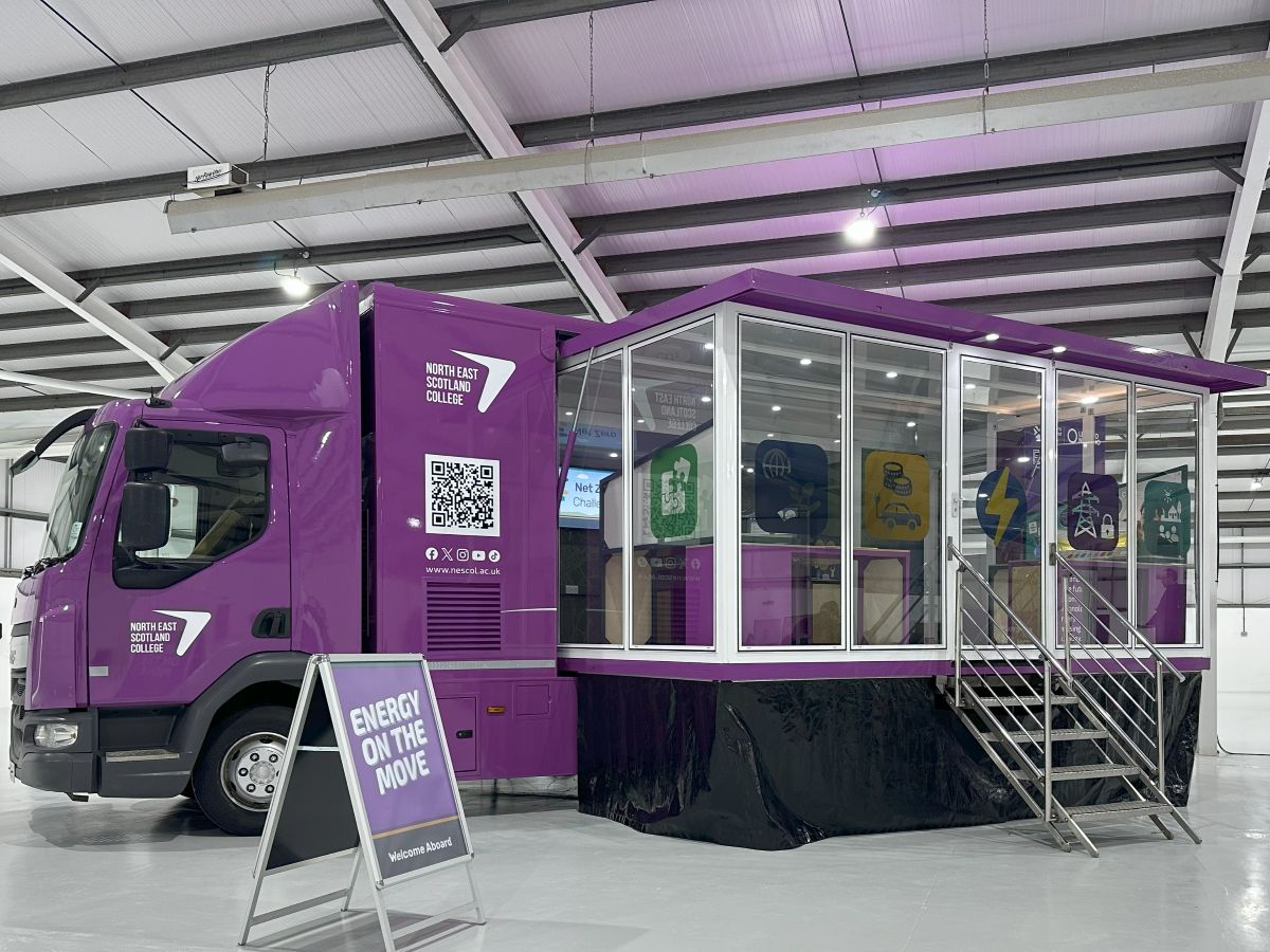 Purple lorry with extended glass side