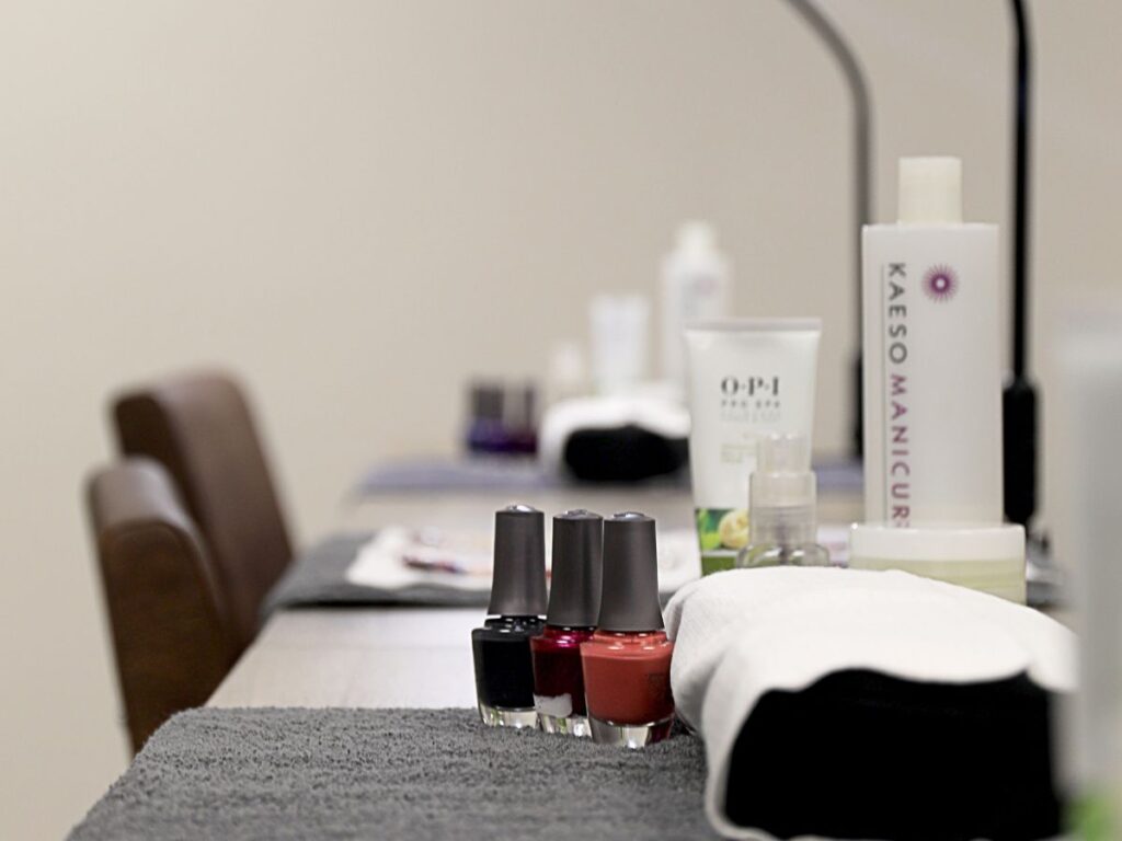 Nail polishes and manicure tools on a table