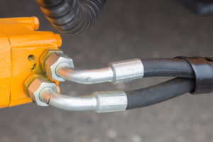 Tubes attached to a machine with nuts