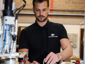 SP Automation & Robotics machine build engineer working on an automation system