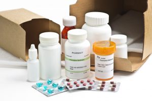 A selection of pill boxes and packaging