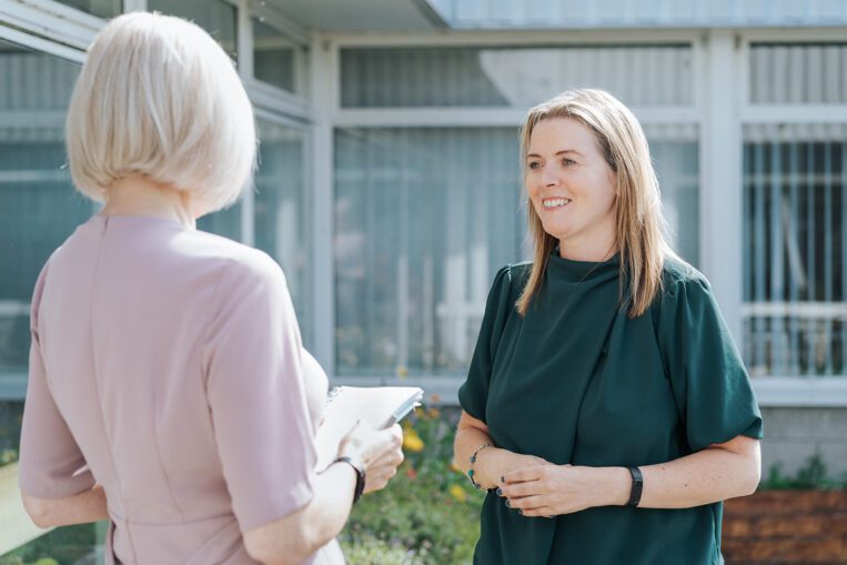 The Circle's consultancy team discussing clients needs in the circle's courtyard.