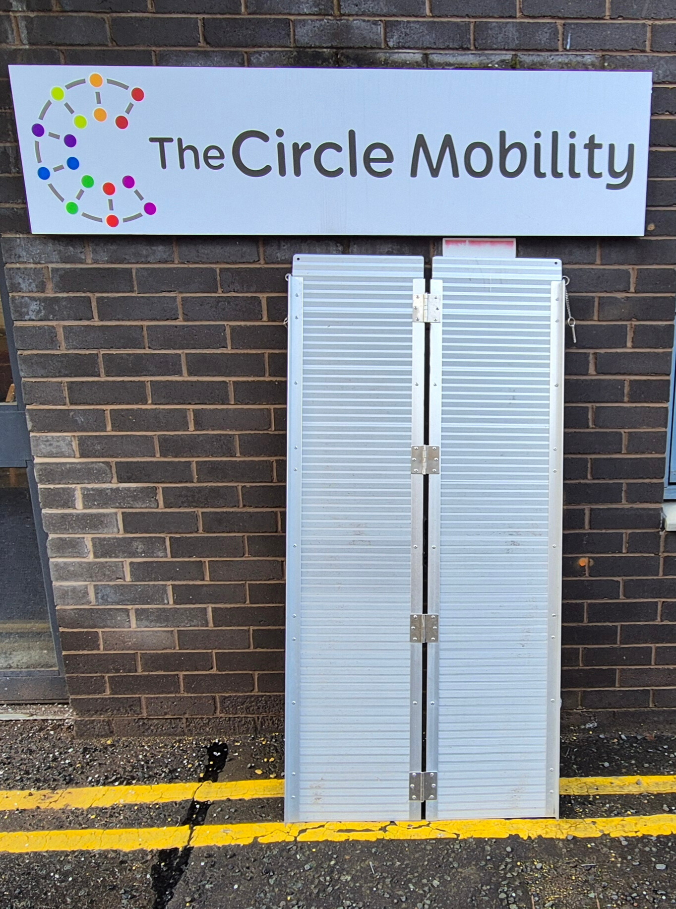 An Image of a ramp beside the circle logo