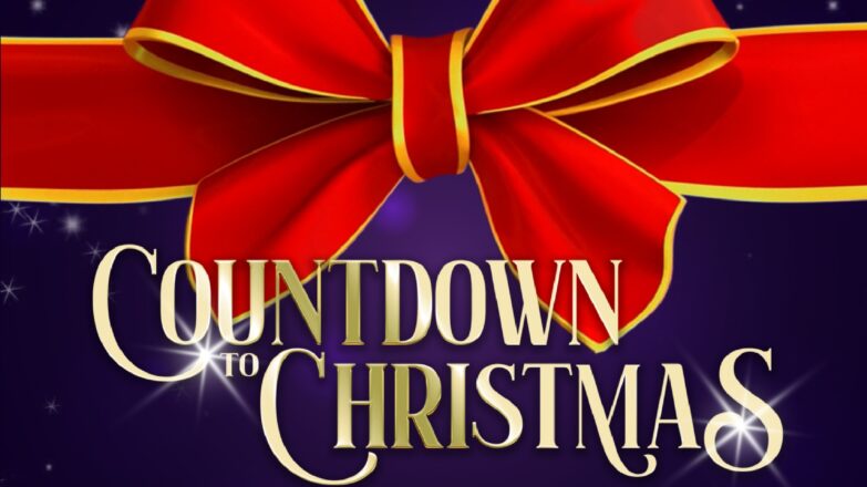 A graphic for "Visit Angus" advertising Christmas markets. The image features a large, realistic red bow with a gold trim against a dark purple, starry background. The text reads: "COUNTDOWN TO CHRISTMAS" in large gold script, with a smaller line below saying: "Explore festive Christmas markets in Angus."