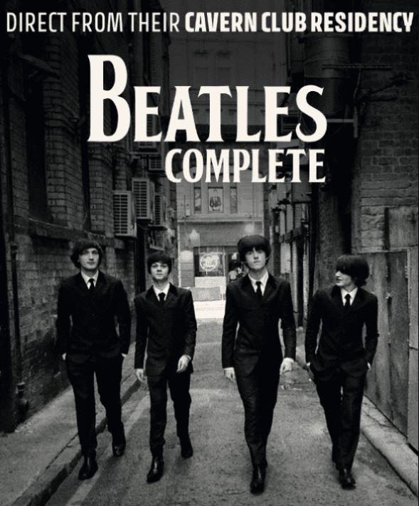 A black and white photograph of four men dressed in matching black suits and ties with mop-top haircuts, walking towards the viewer down a narrow, brick-walled alleyway. The text above reads "DIRECT FROM THEIR CAVERN CLUB RESIDENCY BEATLES COMPLETE."