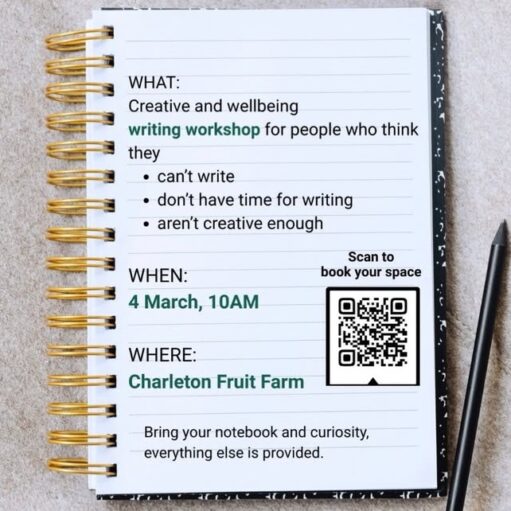 A gold spiral-bound notebook lies open on a textured gray surface with a black pencil beside it. The lined page contains details for a "Creative and wellbeing writing workshop" intended for those who feel they can't write or aren't creative. The event is scheduled for 4 March at 10 AM at Charleton Fruit Farm, and includes a QR code to scan for bookings.