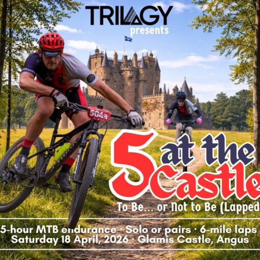 An event poster for "5 at the Castle," a mountain bike endurance race presented by Trilogy. The image features two cyclists in athletic gear racing down a dirt trail with the historic, turreted Glamis Castle in the background. Bold red and white text reads "5 at the Castle: To Be… or Not to Be (Lapped)." Details at the bottom specify a 5-hour MTB endurance event with solo or pair options and 6-mile laps, taking place on Saturday, 18 April, 2026, at Glamis Castle, Angus.