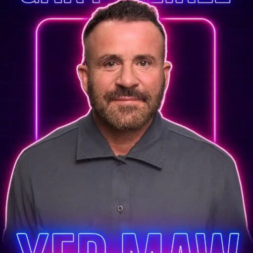 A promotional poster for comedian Gary Meikle's show titled "YER MAW." The image features a portrait of Meikle, a bearded man with short dark hair, wearing a grey button-up shirt. He is centered against a dark background, framed by a glowing pink neon square and bright blue neon text at the top and bottom.