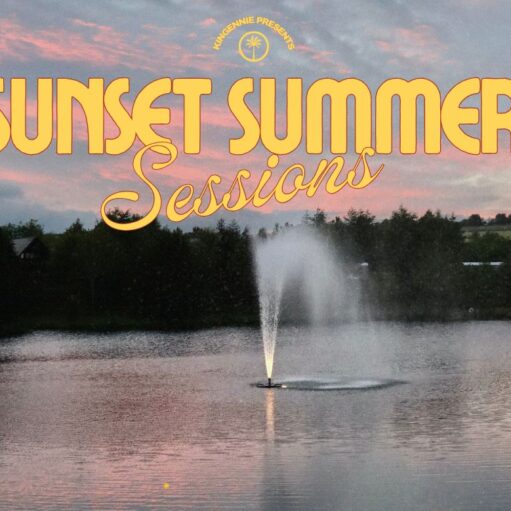 A promotional image featuring a water fountain spraying in the middle of a calm lake during a pink and gray sunset. The sky is filled with soft, colorful clouds above a dark treeline. Large, yellow stylized text overlaid at the top reads "SUNSET SUMMER Sessions," with a small circular logo above it that says "KINGENNIE PRESENTS."