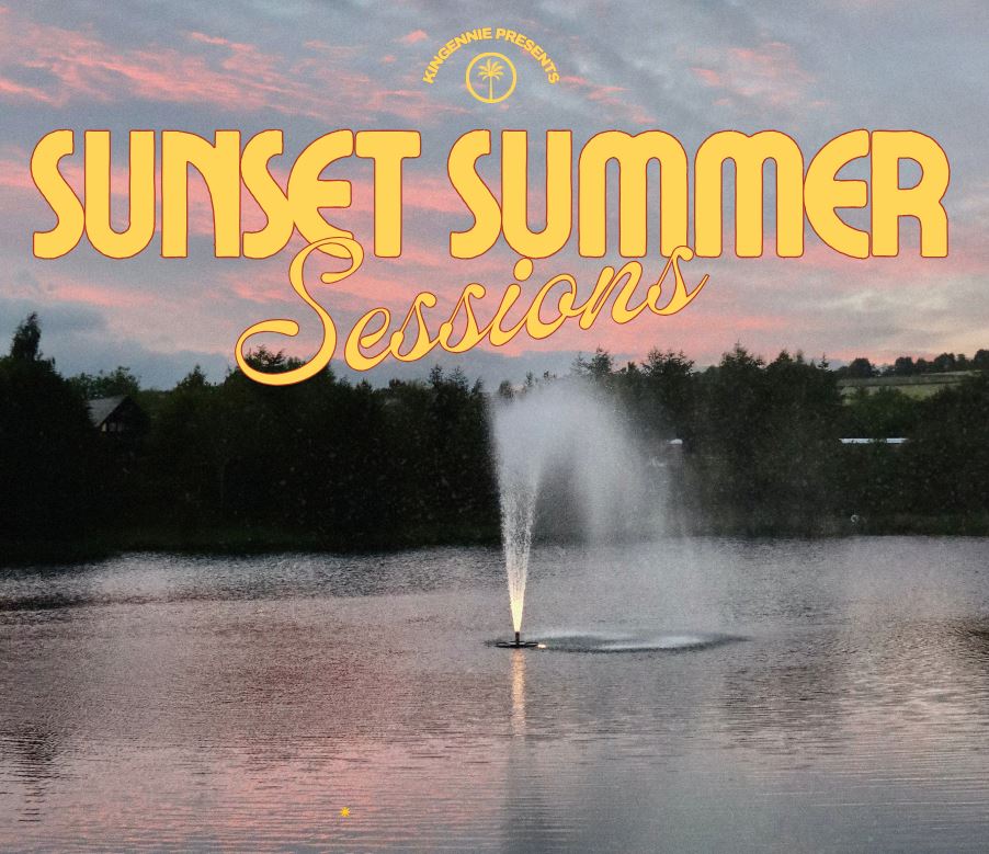 A promotional image featuring a water fountain spraying in the middle of a calm lake during a pink and gray sunset. The sky is filled with soft, colorful clouds above a dark treeline. Large, yellow stylized text overlaid at the top reads "SUNSET SUMMER Sessions," with a small circular logo above it that says "KINGENNIE PRESENTS."