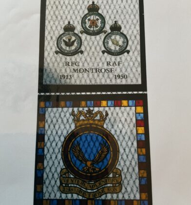 Stained-glass memorial panel featuring Royal Flying Corps and Royal Air Force insignia and crests, with the text “RFC Montrose 1913” and “RAF 1950” above a colourful winged emblem.
