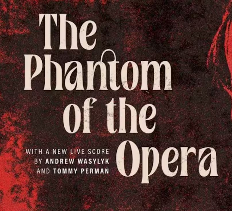 Promotional graphic for The Phantom of the Opera, featuring the title in large cream-coloured lettering against a dark red and black textured background, with text noting a new live score by Andrew Wasylyk and Tommy Perman.