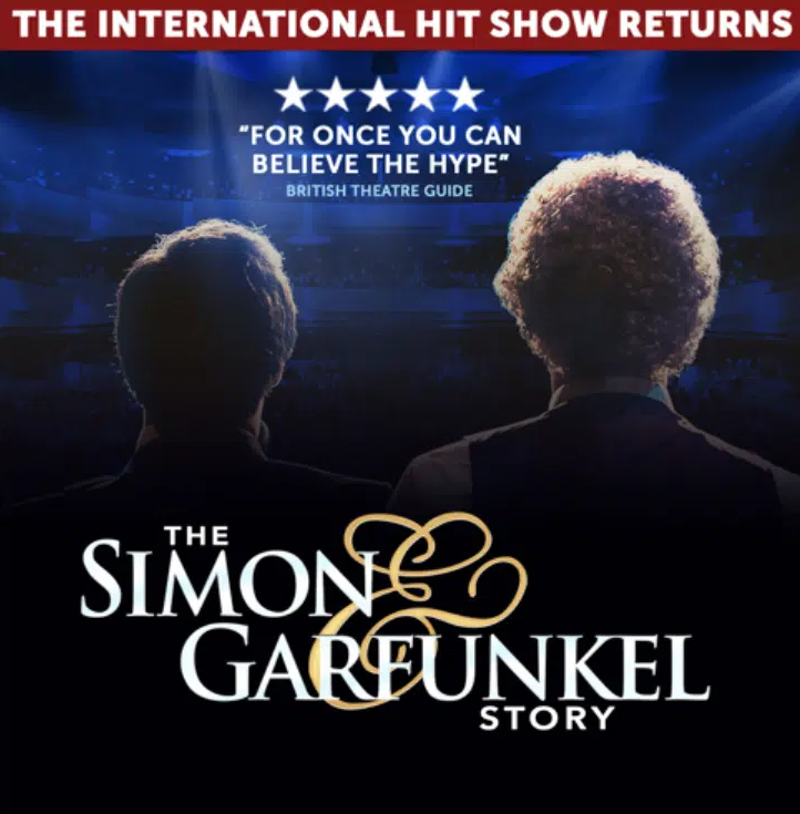 Promotional poster for The Simon & Garfunkel Story, featuring the silhouettes of two performers viewed from behind on a dimly lit stage illuminated by blue spotlights. The poster includes a five-star review quote reading, “For once you can believe the hype” from the British Theatre Guide. Large white and gold lettering displays the title The Simon & Garfunkel Story, with a banner across the top stating, “The International Hit Show Returns.” The overall design uses dark blue and black tones to create a concert-style atmosphere.