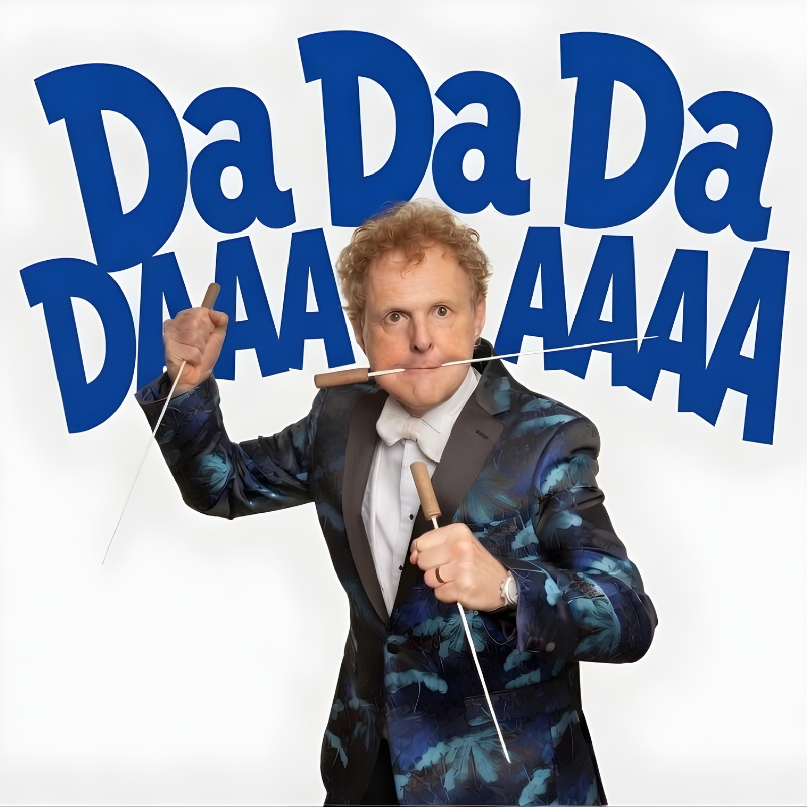 Promotional image featuring a performer in a patterned blue dinner jacket holding two conducting batons, one raised and the other held forward, against a white background. Large bold blue text behind the performer reads “Da Da Da Da.” The clean, high-contrast design creates a playful and energetic visual style, suggesting a music, comedy or orchestral-themed live performance centred on conducting and classical music.