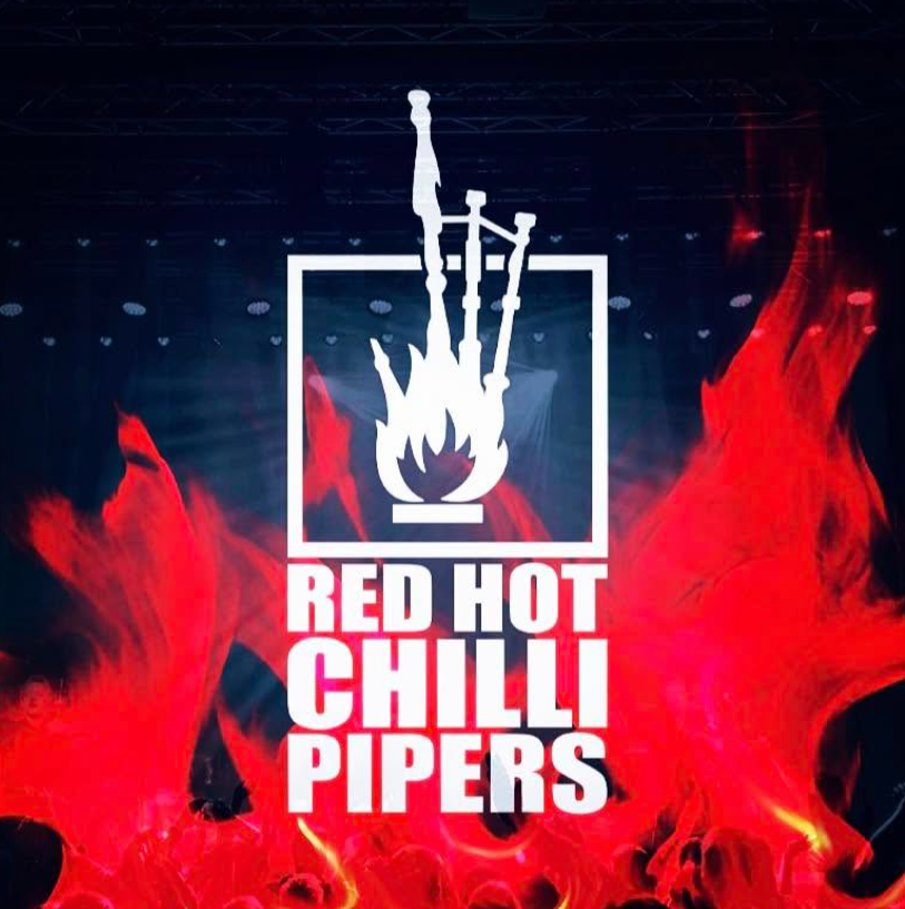 A logo for the band "Red Hot Chilli Pipers" set against a dark stage background framed by bright red flames. The white logo displays a set of bagpipes enveloped in stylized flames inside a square border, with the text "RED HOT CHILLI PIPERS" written in bold capital letters underneath.