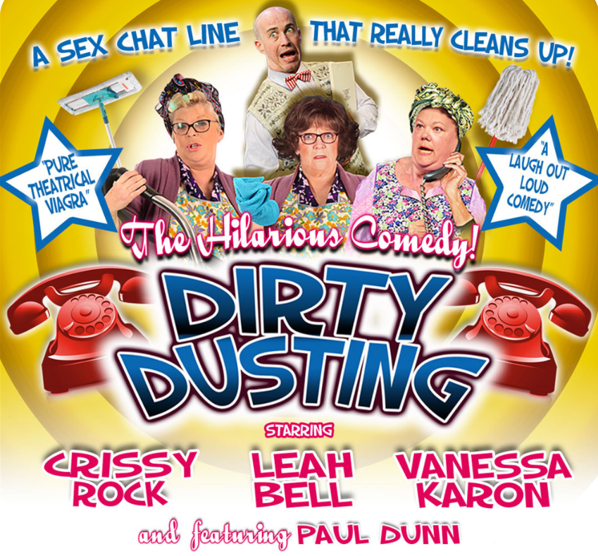A promotional poster for the stage play "Dirty Dusting," featuring three women dressed as cleaners holding phones and cleaning supplies, with a man looking shocked in the background. The title "DIRTY DUSTING" is displayed in bold letters above the cast names: Crissy Rock, Leah Bell, Vanessa Karon, and featuring Paul Dunn.