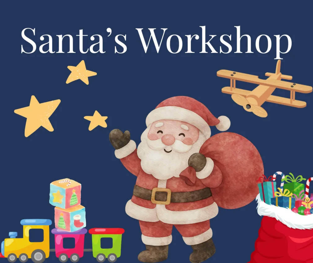 Festive promotional graphic for Santa’s Workshop, featuring a cartoon-style Santa Claus carrying a sack of presents against a dark blue background. The illustration includes colourful toy trains, stacked toy blocks, a wooden aeroplane, yellow stars and a red gift sack filled with wrapped presents beneath the title “Santa’s Workshop”.