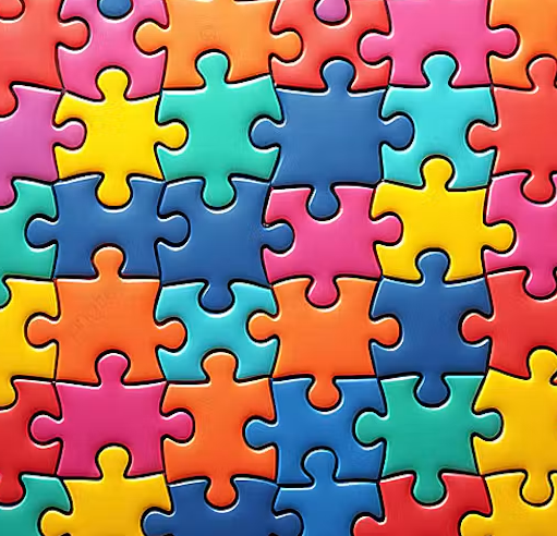 Colourful close-up image of interlocking jigsaw puzzle pieces in bright shades of blue, pink, yellow, orange and green, arranged to fill the entire frame in a repeating pattern.